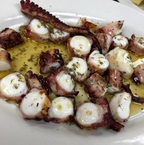 Plate of cut up octopus at Astoria Seafood
