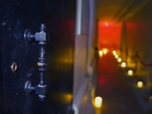 Close up photo of a door handle at the Catacombs by Candlelight Tour in NYC