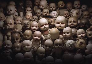 A bunch of creepy dolls at Nightmare Dollhouse, one of the best haunted houses in nyc