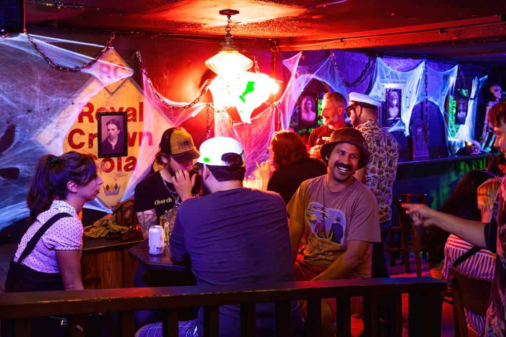 People sitting in a bar at the Black Lagoon halloween bar pop up