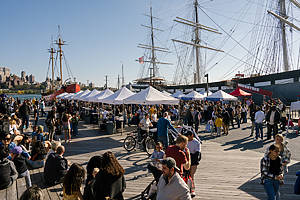 People and stands outside at Taste of the Seaport