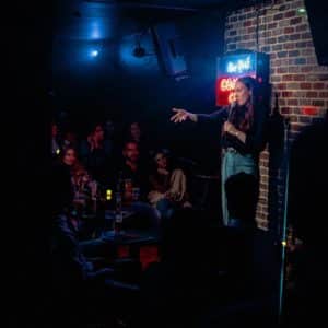 Woman performing at New York Comedy Club in NYC, one of the best comedy clubs nyc