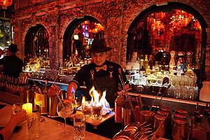 Bartender in Halloween attire at Oscar Wilde bar in NYC.