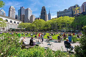 New York, USA - May 10, 2018: People relaxing at Bryant Park in Midtown Manhattan