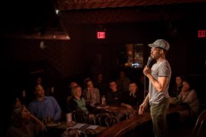 Man performing at Stand Up NY Comedy Club, one of the best comedy clubs nyc